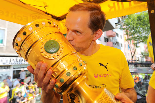 All 9 managers shortlisted to replace Arsene Wenger assessed 2 DORTMUND, GERMANY - MAY 28: Trainer Thomas Tuchel of Borussia Dortmund lifts the DFB Cup trophy as the team celebrates during a winner's parade at Borsigplatz on May 28, 2017 in Dortmund, Germany. (Photo by Pool - Getty Images)