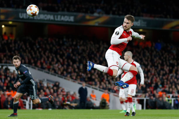 Lacazette and Aubameyang to start together: Arsenal predicted 4-2-3-1 v Newcastle 4 Arsenal's Welsh midfielder Aaron Ramsey scores their third goal with this flick during the UEFA Europa League first leg quarter-final football match between Arsenal and CSKA Moscow at the Emirates Stadium in London on April 5, 2018. / AFP PHOTO / IKIMAGES / Ian KINGTON