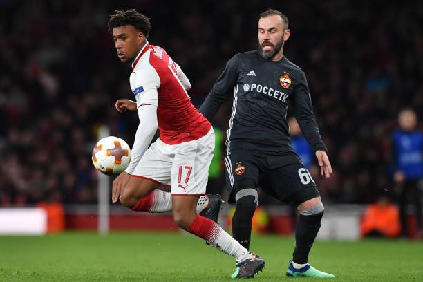 Arsenal's Nigerian striker Alex Iwobi (L) runs away from CSKA Moscow's Israeli midfielder Bibras Natcho during the UEFA Europa League first leg qua...