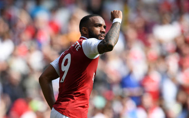 ONDON, ENGLAND - APRIL 22: Alexandre Lacazette of Arsenal celebrates scoring his side's third goal during the Premier League match between Arsenal ...