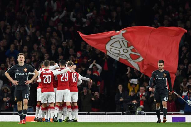 Arsenal players celebrate Ramsey's early goal during the UEFA Europa League first leg quarter-final football match between Arsenal and CSKA Moscow ...