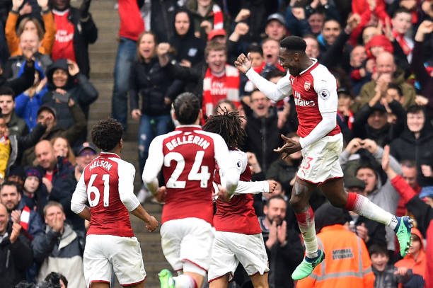 Arsenal's English striker Danny Welbeck (R) celebrates scoring the team's second goal during the English Premier League football match between Arse...