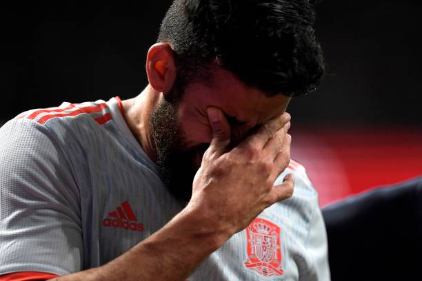 Spain's forward Diego Costa reacts in pain after getting injured while scoring a goal during a friendly football match between Spain and Argentina ...