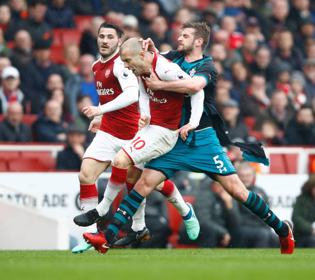 LONDON, ENGLAND - APRIL 08: Jack Stephens of Southampton clashes with Jack Wilshere of Arsenal which later leads to Jack Stephens of Southampton be...