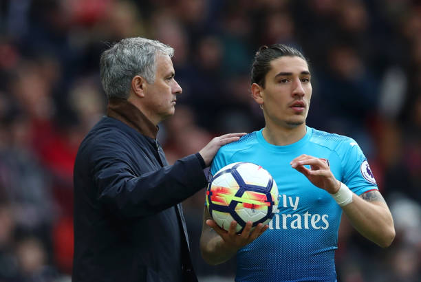 MANCHESTER, ENGLAND - APRIL 29: Jose Mourinho, Manager of Manchester United pats Hector Bellerin of Arsenal on the shoulder as he prepares to take ...