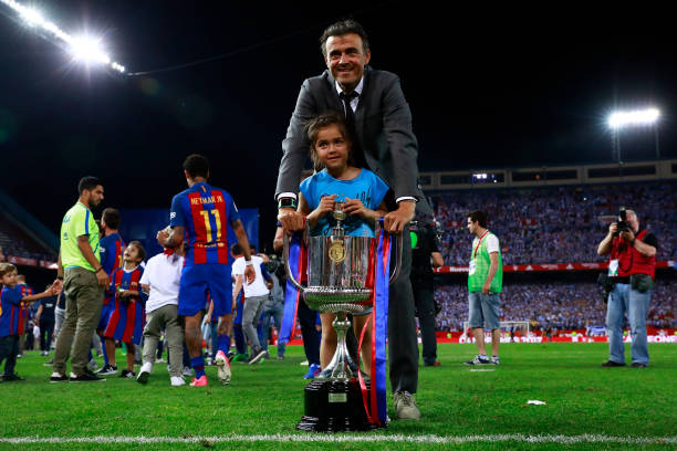 Favourite to replace Arsene Wenger demands £15m-a-year 2 MADRID, SPAIN - MAY 27: Head coach Luis Enrique Martinez of FC Barcelona poses with his daughte for a picture with the King's Cup after winning the Copa Del Rey Final between FC Barcelona and Deportivo Alaves at Vicente Calderon Stadium on May 27, 2017 in Madrid, Spain. (Photo by Gonzalo Arroyo Moreno/Getty Images)