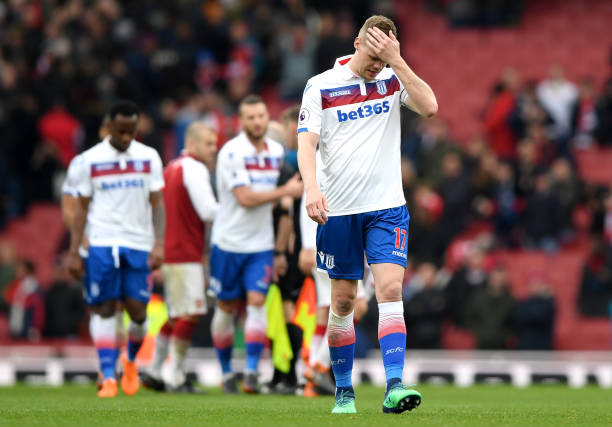 LONDON, ENGLAND - APRIL 01: Ryan Shawcross of Stoke City and his team mates walk off dejected after the Premier League match between Arsenal and St...