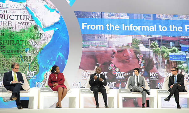 John Quelch (L), Charles Edward Wilson Professor of Business Administration at Harvard Business School, Clare Akamanzi (2nd L) Chief Operating Officer of the Rwanda Development Board, Jean baptiste Bikalou (C) President of the Chamber of commerce of Gabon and CEO of PetroGabon, Steve Daniels (2nd R) editor-in-chief of Makeshift Magazine, and Paolo Montessori (R), Chief Executive Officer and Managing Director of eServGlobal AFP PHOTO / STEVE JORDAN