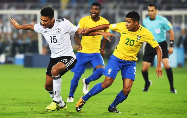 Josha Vagnoman (L) of Germany and Brenner of Brazil compete for the ball during the quarterfinal football match of the FIFA U-17 World Cup at the V...