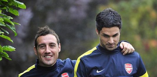 Arsenal's Spanish midfielder Santi Cazorla (L) and Spanish midfielder Mikel Arteta (R) attend training for the forthcoming UEFA Champions League group B football match against FC Schalke 04 at Arsenal's training ground, London Colney, North London, England on October 23, 2012. AFP PHOTO/GLYN KIRK