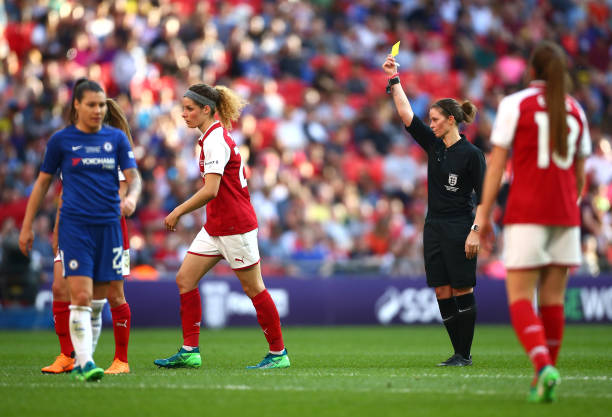 LONDON, ENGLAND - MAY 05: Dominique Janssen of Arsenal is shown a yellow card by referee Lindsey Robinson during the SSE Women's FA Cup Final match...