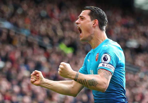 MANCHESTER, ENGLAND - APRIL 29: Granit Xhaka of Arsenal celebrates his sides second goal during the Premier League match between Manchester United and Arsenal at Old Trafford on April 29, 2018 in Manchester, England. (Photo by Clive Brunskill/Getty Images)