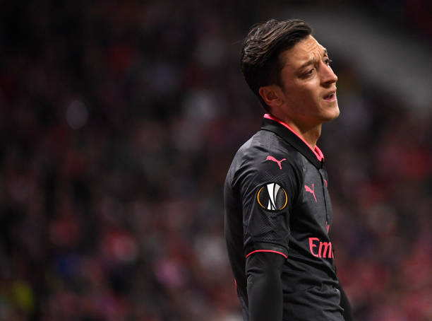 Arsenal's German midfielder Mesut Ozil gestures during the UEFA Europa League semi-final second leg football match between Club Atletico de Madrid and Arsenal FC at the Wanda Metropolitano stadium in Madrid on May 3, 2018.. (Photo by PIERRE-PHILIPPE MARCOU / AFP)