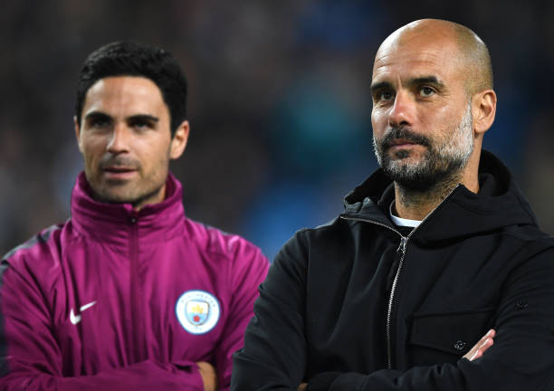 MANCHESTER, ENGLAND - MAY 09: Mikel Arteta and Josep Guardiola, Manager of Manchester City looks on during the Premier League match between Manches...