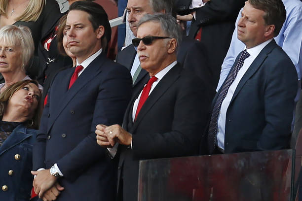 Arsenal's US owner Stan Kroenke (C) looks on during the presentation to Arsenal's French manager Arsene Wenger after the English Premier League foo...