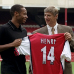 LONDON, UNITED KINGDOM - AUGUST 3: Striker Thierry Henry (L) holds up his shirt with Manager Arsene Wenger having been signed for Arsenal 03 August, 1999 from Juventus for an undisclosed fee. The 21-year old French international, who played under Arsene Wenger at AS Monaco was the leading scorer for the French World Cup winning squad at France '98 scoring three goals during the tournament. (Photo credit SINEAD LYNCH/AFP/Getty Images)