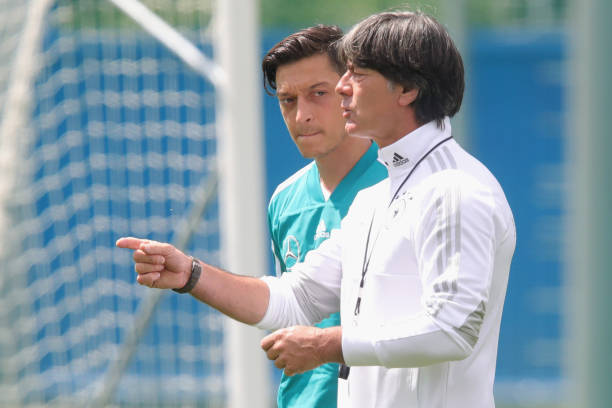 MOSCOW, RUSSIA - JUNE 13: Joachim Loew, head coach of Germany talks to his palyer Mesut Oezil during the Germany training session ahead of the 2018...
