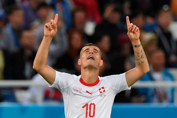 Switzerland's midfielder Granit Xhaka celebrates scoring during their Russia 2018 World Cup Group E football match between Serbia and Switzerland a...