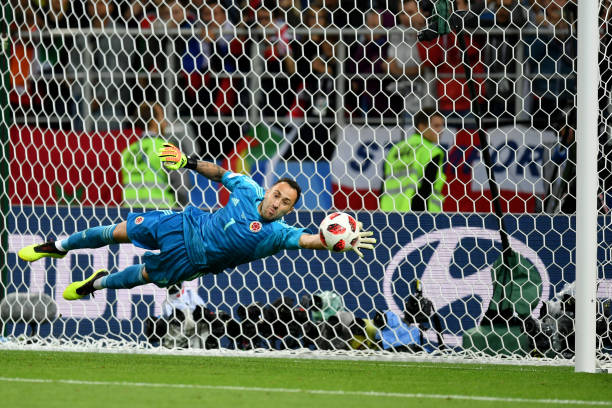 MOSCOW, RUSSIA - JULY 03: David Ospina of Colombia saves the third penalty from Jordan Henderson of England in the penalty shoot out during the 201...