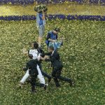 MOSCOW, RUSSIA - JULY 15: Pitch invaders are being taken off the pitch during World Cup trophy presentation following the 2018 FIFA World Cup Final between France and Croatia at Luzhniki Stadium on July 15, 2018 in Moscow, Russia. (Photo by Kevin C. Cox / Getty Images)