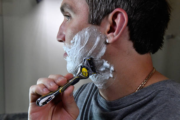 MCLEAN, VA - JUNE 13: World Champion hockey star Alex Ovechkin shaves his 'playoff beard' with the Gillette Fusion ProShield Razor during an offici...