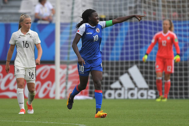 Haiti's forward Nerilia Mondesir (C) celebrates after scoring a goal during the Women's World Cup U20 Group D football match between Germany and Haiti on August 13, 2018, at the Rabine Stadium in Vannes, western France. (Photo by LOIC VENANCE / AFP) 