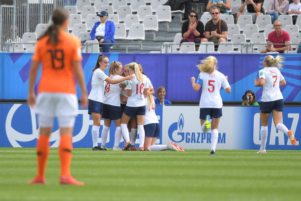 England's players celebrate after scoring during the Women's World Cup U20 quarter final football match between England and Netherlands on August 17, 2018, at the La Rabine Stadium in Vannes, western France. (Photo by LOIC VENANCE / AFP) 