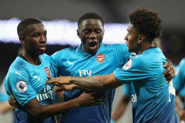 LONDON, ENGLAND - APRIL 20: Edward Nketiah of Arsenal celebrates with teammates Josh Dasilva and Reiss Nelson after scoring his sides third goal du...