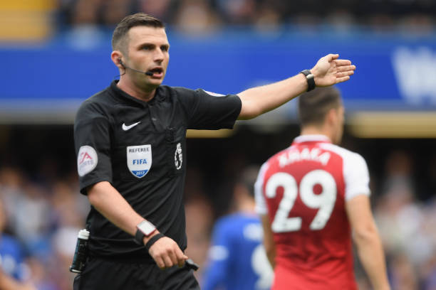 LONDON, ENGLAND - SEPTEMBER 17: Referee Michael Oliver gestures during the Premier League match between Chelsea and Arsenal at Stamford Bridge on S...