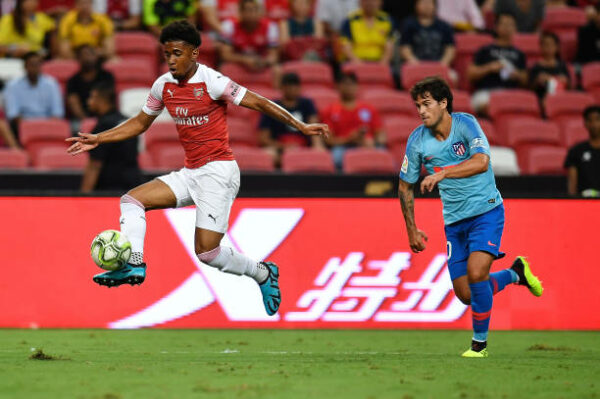 SINGAPORE - JULY 26: Reiss Nelson #48 of Arsenal holds the ball during the International Champions Cup 2018 match between Club Atletico de Madrid a...