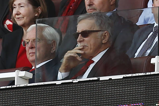 Arsenal's US owner Stan Kroenke (R) looks on during the English Premier League football match between Arsenal and Burnley at the Emirates Stadium i...