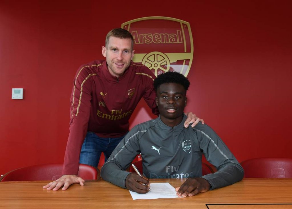 Arsenal man wanted for vacant Managing Director role 3 Bukayo Saka signs a contract for Arsenal with Academy Manager Per Mertesacker. Arsenal Training Ground. London Colney, Herts, 11/9/18. Credit : Arsenal Football Club / David Price.