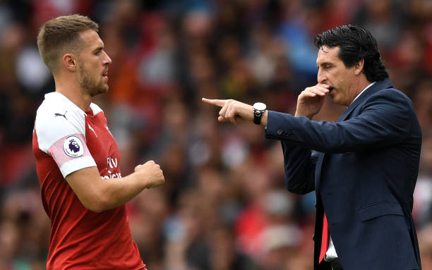 LONDON, ENGLAND - AUGUST 12: Unai Emery, Manager of Arsenal gives instructions to Aaron Ramsey of Arsenal during the Premier League match between A...