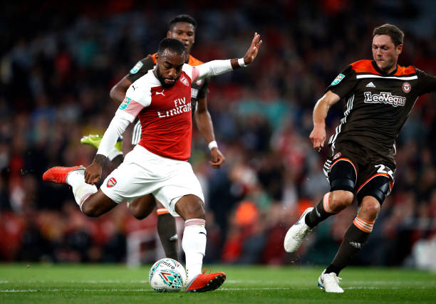 LONDON, ENGLAND - SEPTEMBER 26: Alexandre Lacazette of Arsenal scores his sides third goal during the Carabao Cup Third Round match between Arsenal...