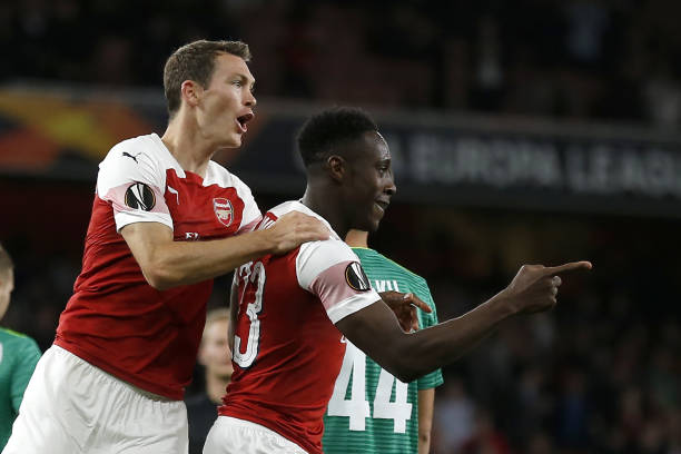 Arsenal's English striker Danny Welbeck (R) celebrates with Arsenal's Swiss defender Stephan Lichtsteiner after scoring the team's second goal duri...