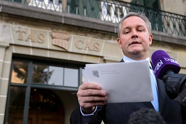 Court of Arbitration for Sport (CAS TAS) Secretary-general Matthieu Reeb reads the sentence of the court after an appeal of UEFA president Michel P...