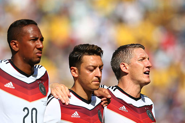 RIO DE JANEIRO, BRAZIL - JULY 04: (L-R) Jerome Boateng, Mesut Oezil and Bastian Schweinsteiger of Germany sing the National Anthem prior to the 201...