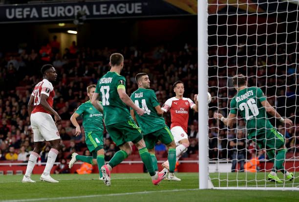 LONDON, ENGLAND - SEPTEMBER 20: Mesut Ozil of Arsenal scores his team's fourth goal during the UEFA Europa League Group E match between Arsenal and...