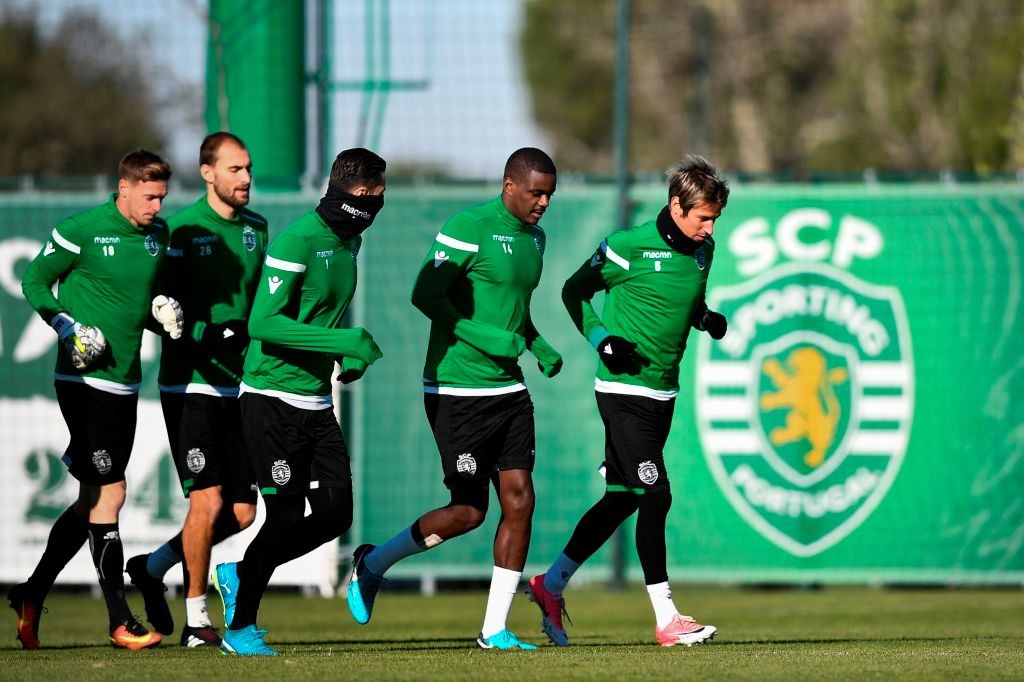 Sporting Lisbon v Arsenal: Stats, history, form, press conference, more 4 Sporting's Dutch forward Bas Dost (2L), French goalkeeper Romain Salin (L), Portuguese goalkeeper Rui Patricio (C), Portuguese midfielder William de Carvalho (2R) and Portuguese defender Fabio Coentrao attend a training session at Sporting's training ground in Alcochete, outskirts of Lisbon, on December 4, 2017, on the eve of the Champions League match, group D, Barcelona vs Sporting CP. / AFP PHOTO / PATRICIA DE MELO MOREIRA / Getty Images