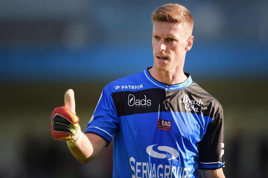 Guingamp's French goalkeeper Romain Salin gestures during the friendly football match between Lorient and Guingamp on July 23, 2016 in Pontivy, wes...