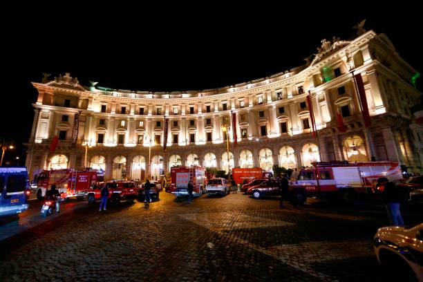 First responders gather on Piazza della Repubblica in central Rome to evacuate wounded persons on October 23, 2018 after around 20 people were inju...