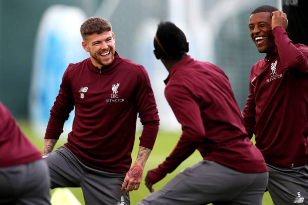 LIVERPOOL, ENGLAND - SEPTEMBER 17: Alberto Moreno (L), Georginio Wijnaldum (R) and Sadio Mane of Liverpool laugh during a Liverpool training sessio...