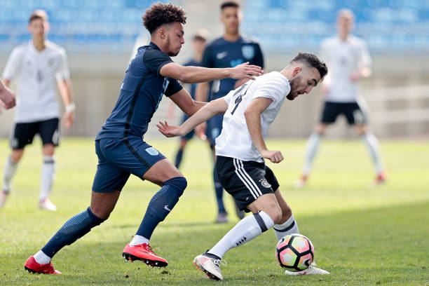 FARO, PORTUGAL - FEBRUARY 11: Erkan Eyibil (R) of Germany U17 chalenges Dylan Crowe (L) of England U17 during U17-Juniors Algarve Cup match between U17 Germany and U17 England at Algarve Stadium on February 11, 2018 in Faro, Portugal. (Photo by Ricardo Nascimento/Getty Images)