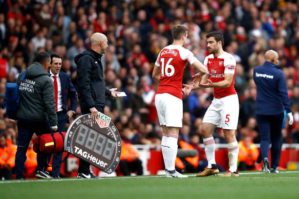 LONDON, ENGLAND - SEPTEMBER 23: Sokratis Papastathopoulos of Arsenal is substituted for Rob Holding of Arsenal during the Premier League match between Arsenal FC and Everton FC at Emirates Stadium on September 23, 2018 in London, United Kingdom. (Photo by Julian Finney/Getty Images)