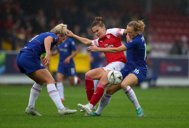 KINGSTON UPON THAMES, ENGLAND - OCTOBER 14: Millie Bright and Magdalena Eriksson of Chelsea battle with Vivianne Miedema of Arsenal during the FA W...