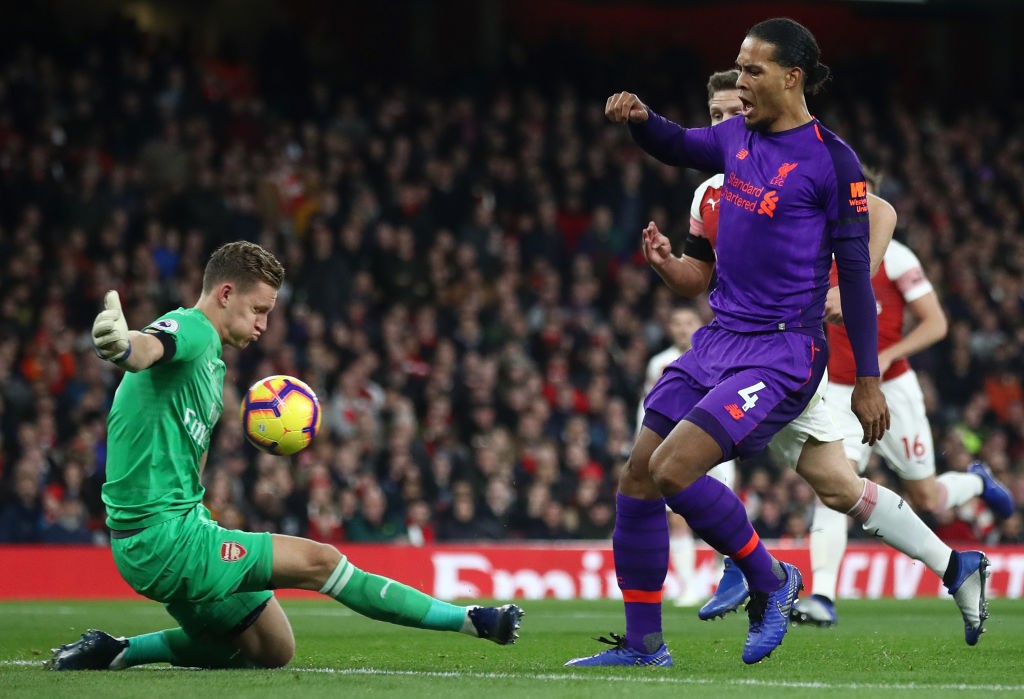 LONDON, ENGLAND - NOVEMBER 03: Virgil van Dijk of Liverpool shoots as Bernd Leno of Arsenal makes a save during the Premier League match between Ar...