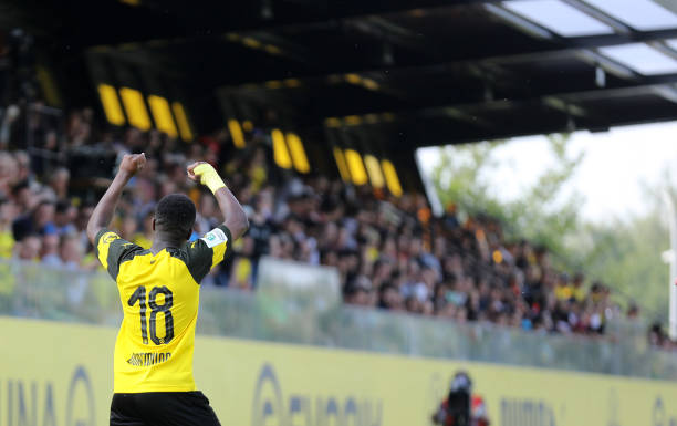 DORTMUND, GERMANY - JUNE 10: Youssoufa Moukoko of Dortmund celebrates scoring the 2:0 goal with fans during the U17 - B Juniors match between Borussia Dortmund U17 and Bayer Leverkusen U17 on June 10, 2018 in Dortmund, Germany. (Photo by Mika Volkmann/Bongarts/Getty Images)