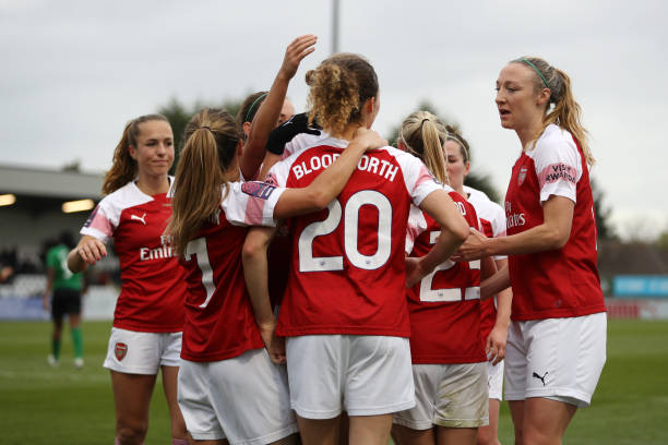 BOREHAMWOOD, ENGLAND - NOVEMBER 25: Dominique Bloodwoth of Arsenal celebrates with her team mates after scoring their team's second goal during the...