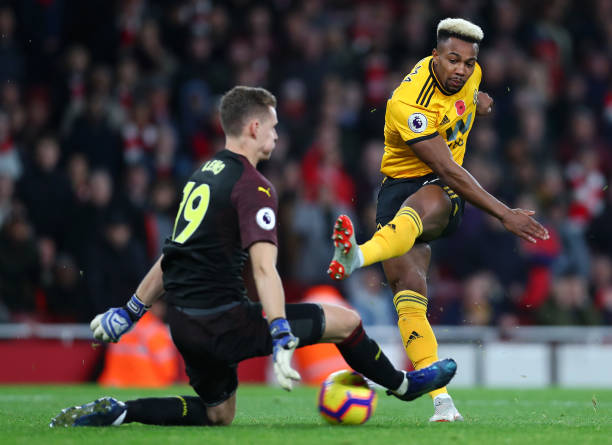 LONDON, ENGLAND - NOVEMBER 11: Adama Traore of Wolverhampton Wanderers shoots as Bernd Leno of Arsenal attempts to save during the Premier League m...
