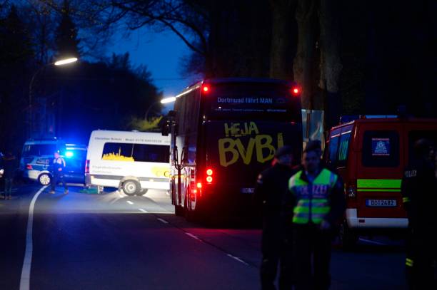 TOPSHOT - The bus of Borussia Dortmund was damaged by explosion some 10km away from the stadium prior to the UEFA Champions League 1st leg quarter-final football match BVB Borussia Dortmund v Monaco in Dortmund, western Germany on April 11, 2017. / AFP PHOTO / Sascha Schuermann